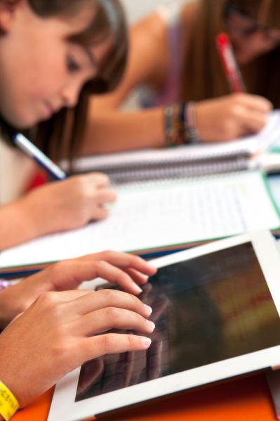 Middle School student working on a tablet.