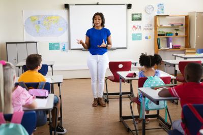 Teacher in front of students in classroom
