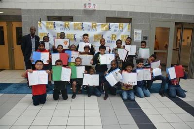 Real Men Read Kick-off event:  Patrick Oliver, author and keynote speaker, worked with the young men in the Boys to Men program to create a vision board based on his book, On My Own:  Vision Board Guidebook for Young People