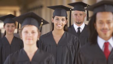 high school students in graduation caps and gowns