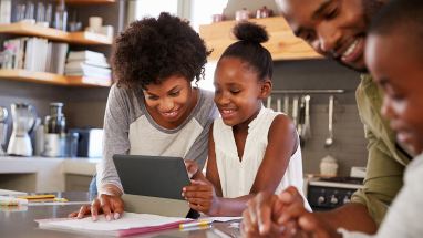 Parents helping children with homework