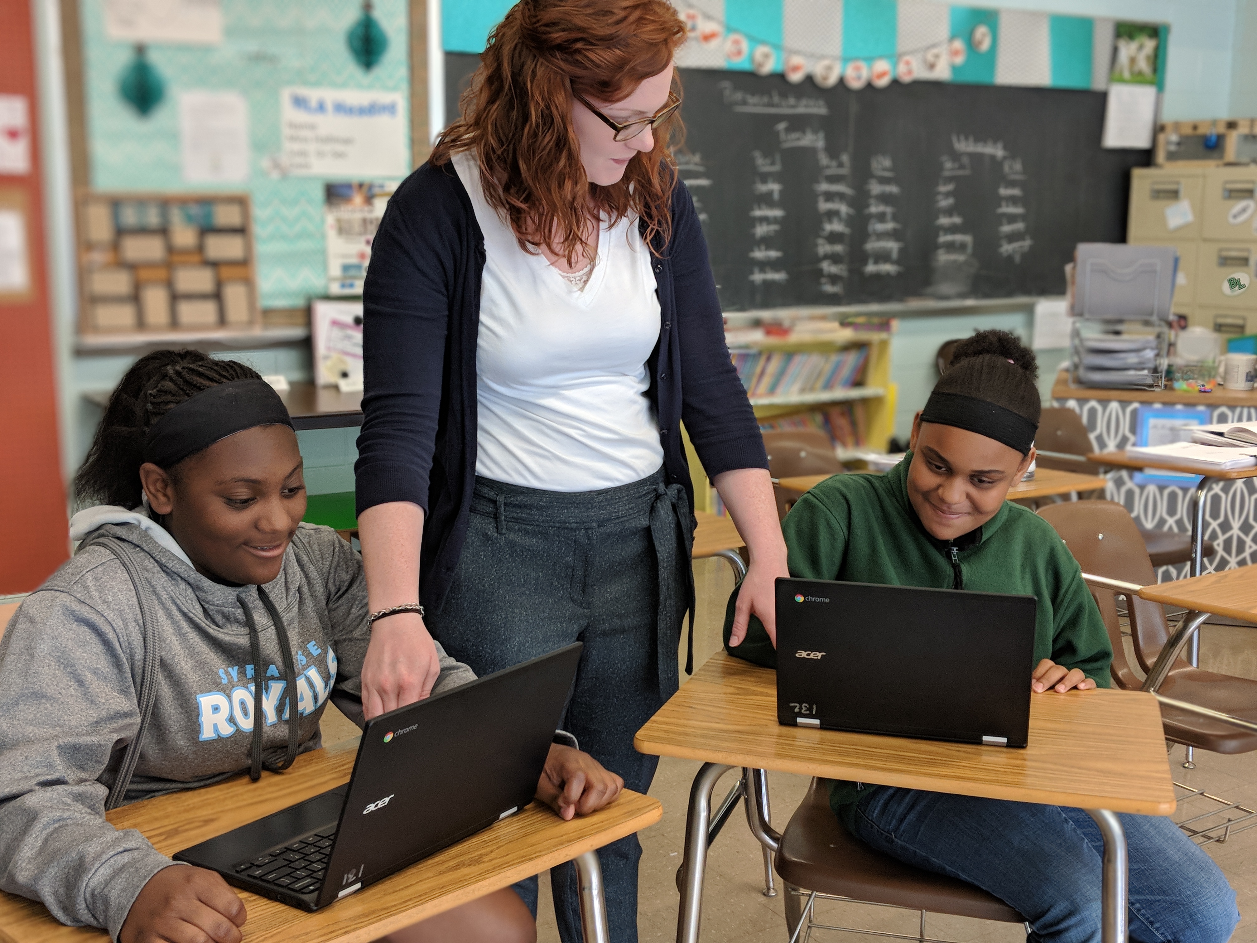 Teacher teaching students.