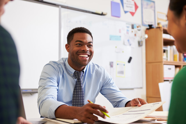 teacher at desk