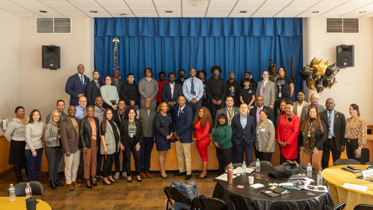 NYSED Assistant Commissioner Anael Alston with Uniondale MBK Community Steering Committee staff members and students.